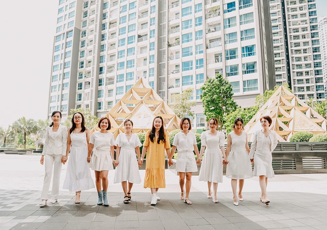 How can women in leadership positions overcome stereotypes and be successful?